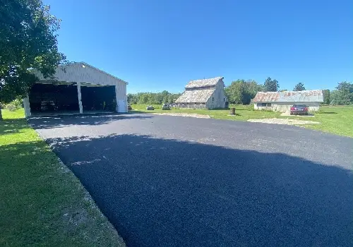 A garage in a farm with recent Asphalt Paving in LaSalle IL