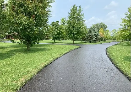 A roadway that spits into two, with recent Sealcoating in LaSalle IL