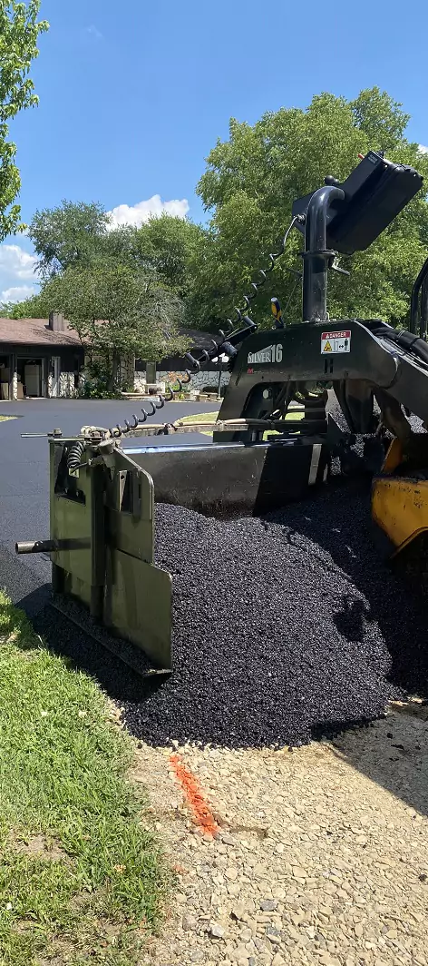 Asphalt being paved onto a new roadway