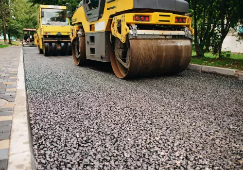 Asphalt work is seen underway. Berchtold Asphalt performs Driveway Repair in Moline IL.