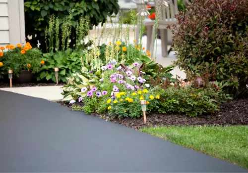 A fresh asphalt driveway is seen. Berchtold Asphalt performs paving in Princeton IL.